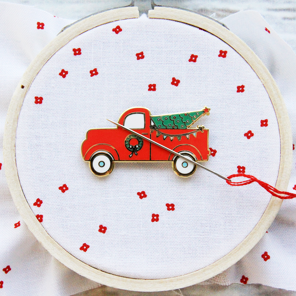 Happy Little Things Quilt Block 4 by popular quilting blog, Flamingo Toes: image of a Christmas Needle Minder enamel vintage truck Christmas pin.