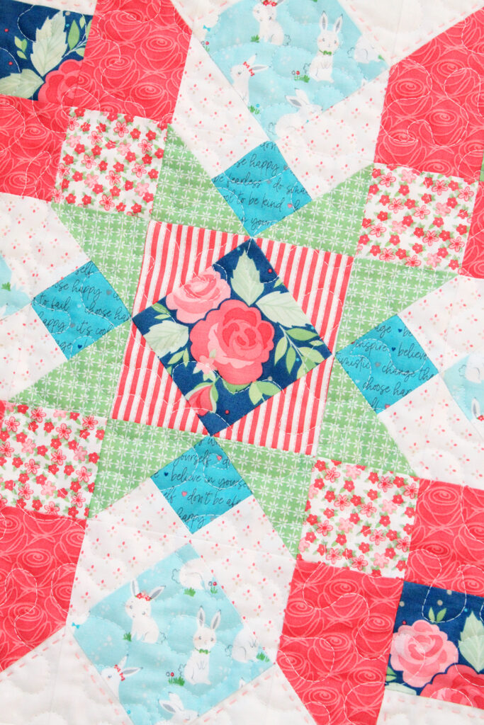 Winifred Rose Mini Quilt by popular US quilting blog, Flamingo Toes: image of a Winifred Rose Mini Quilt.