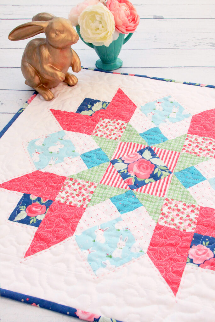 Winifred Rose Mini Quilt by popular US quilting blog, Flamingo Toes: image of a Winifred Rose Mini Quilt.